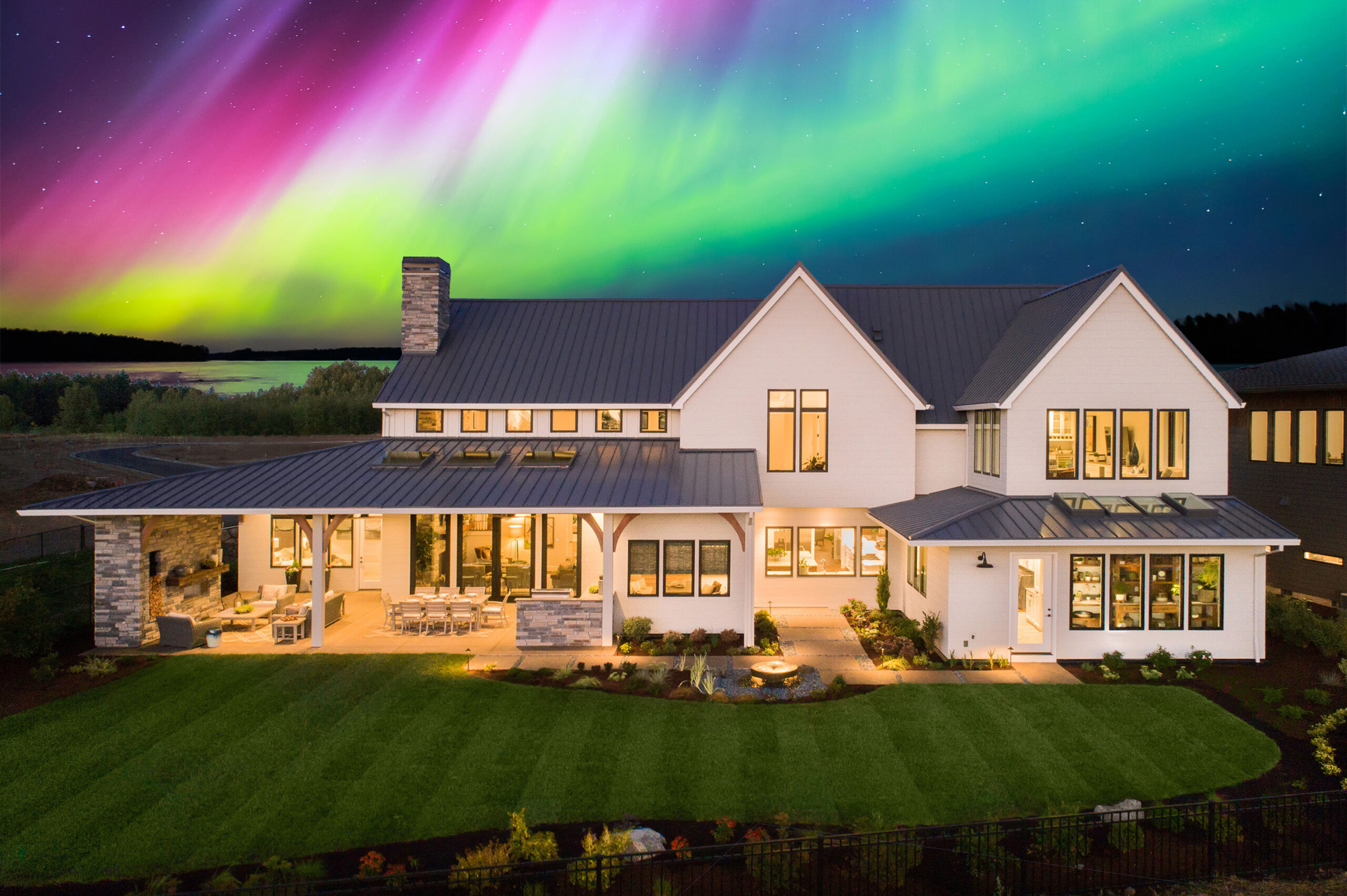 Beautiful Home Exterior with the northern lights in the background.